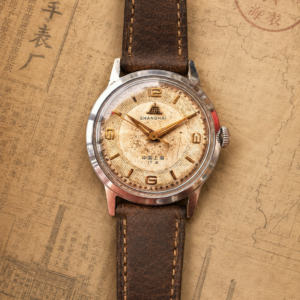 Shanghai A581 with a champagne full-Arabic numeral dial (Rarity: 7/10)